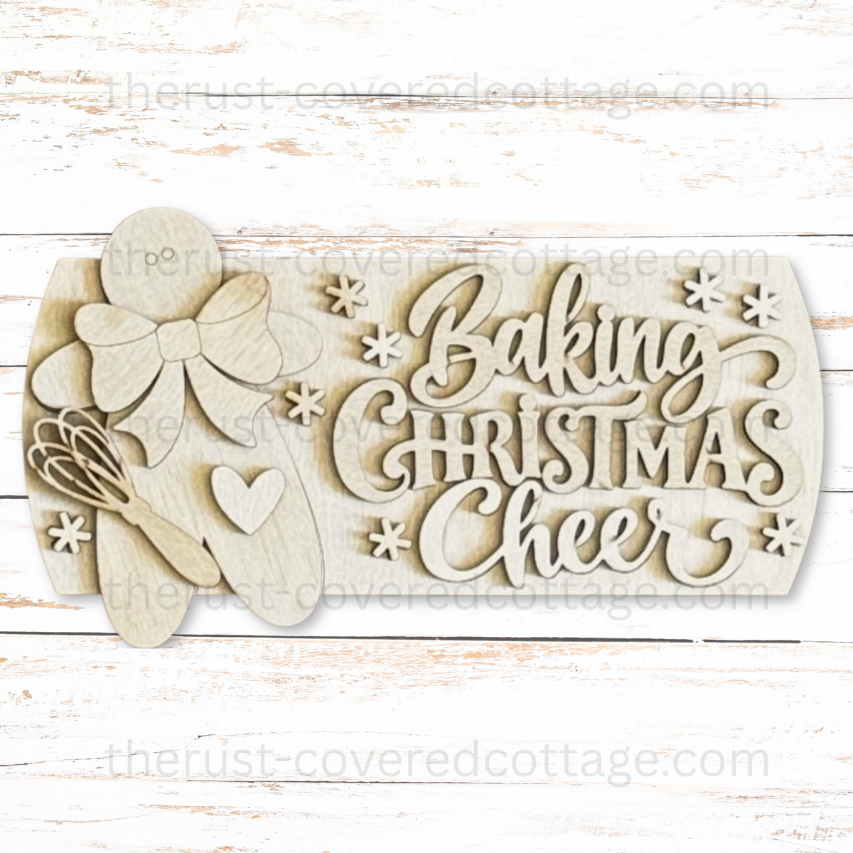 Unfinished Baking Christmas Cheer Interchangeable Round Insert with a gingerbread figure, large bow, heart, whisk, and snowflake accents.