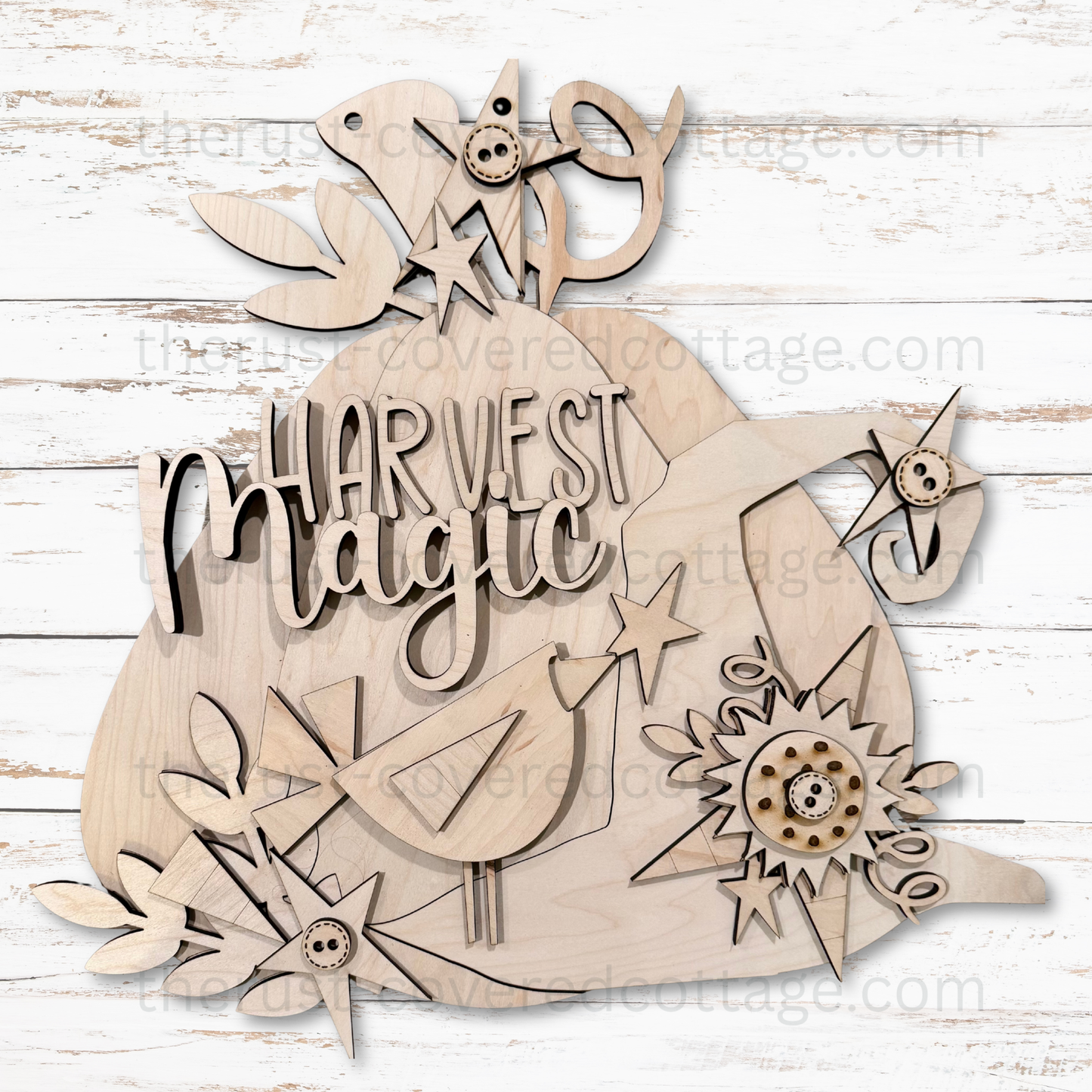 Unfinished Harvest Magic multi-layered DIY wood door hanger featuring a pumpkin, bird, flowers, stars and dimensional lettering