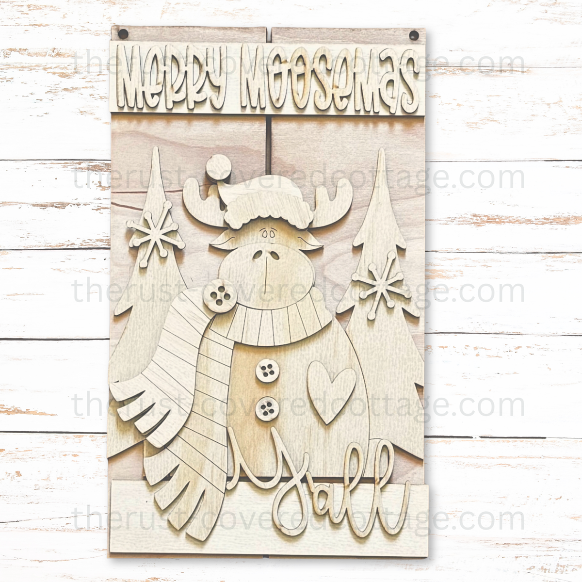 Unfinished Merry Moosemas Y'all pallet-style wood sign with a moose in a Santa hat and striped scarf, trees, snowflakes, buttons, and a heart.