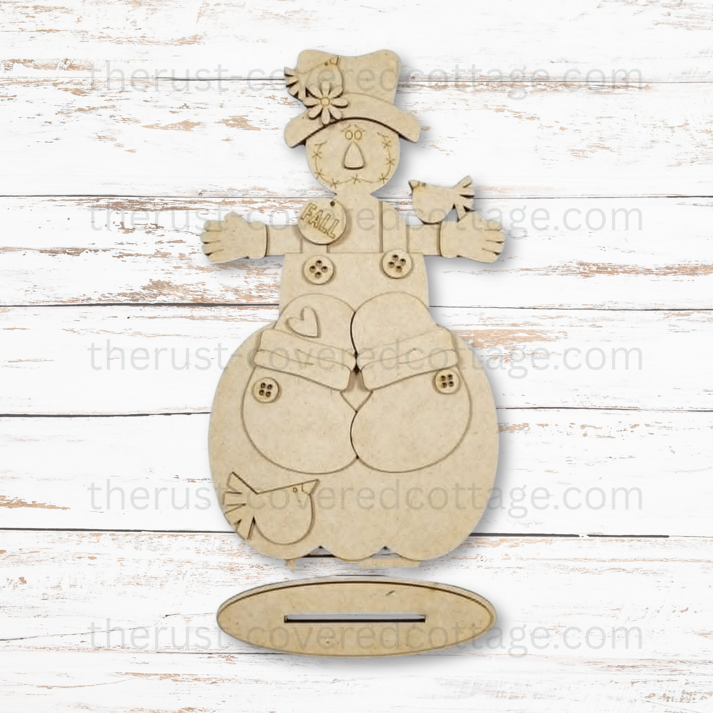 Scarecrow Pumpkin Shelf Sitter unfinished multi-layered DIY wood kit featuring a scarecrow, oversized pumpkin, two crows and slotted display base