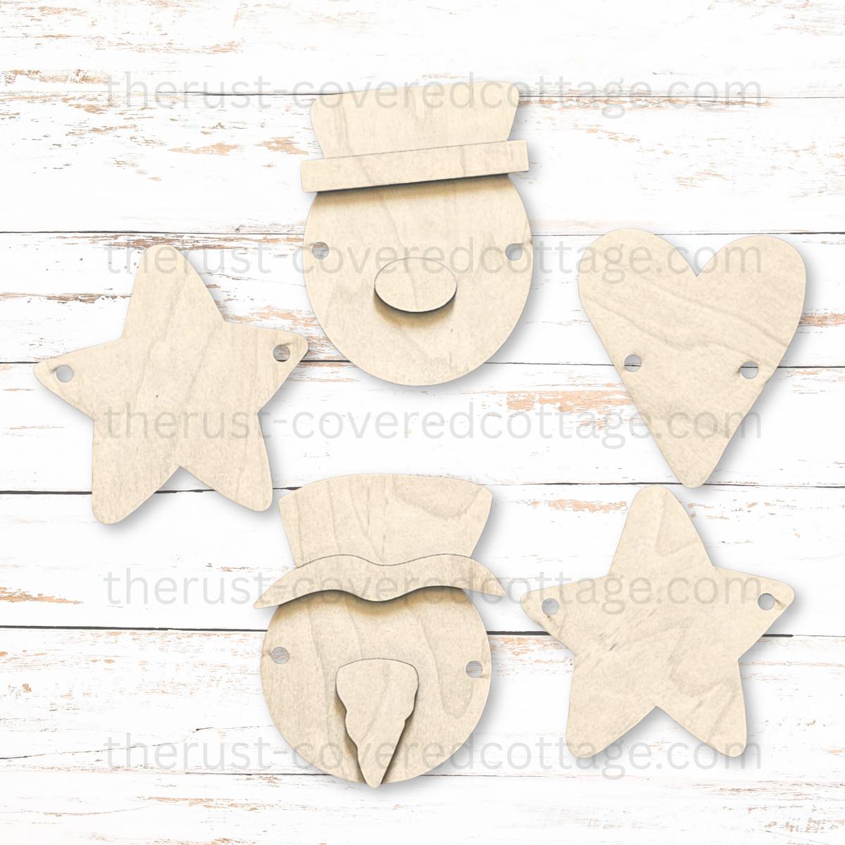 Unfinished Snowman Faces Garland wood kit with two snowman faces, layered hats and noses, two stars, a heart, and pre-cut stringing holes.