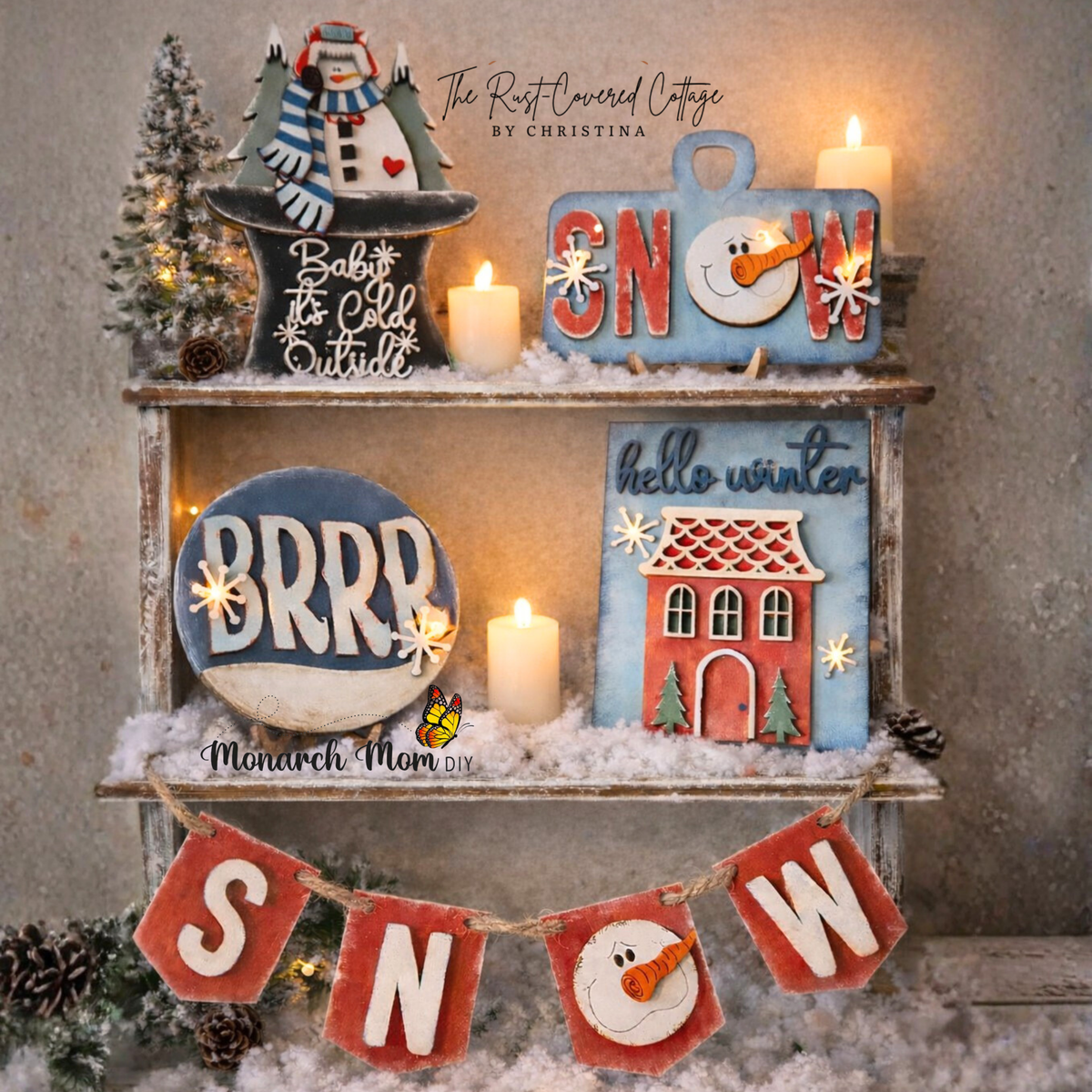 Winter Snowman Decor Set painted red, blue and white, displayed on shelves with a SNOW banner.
