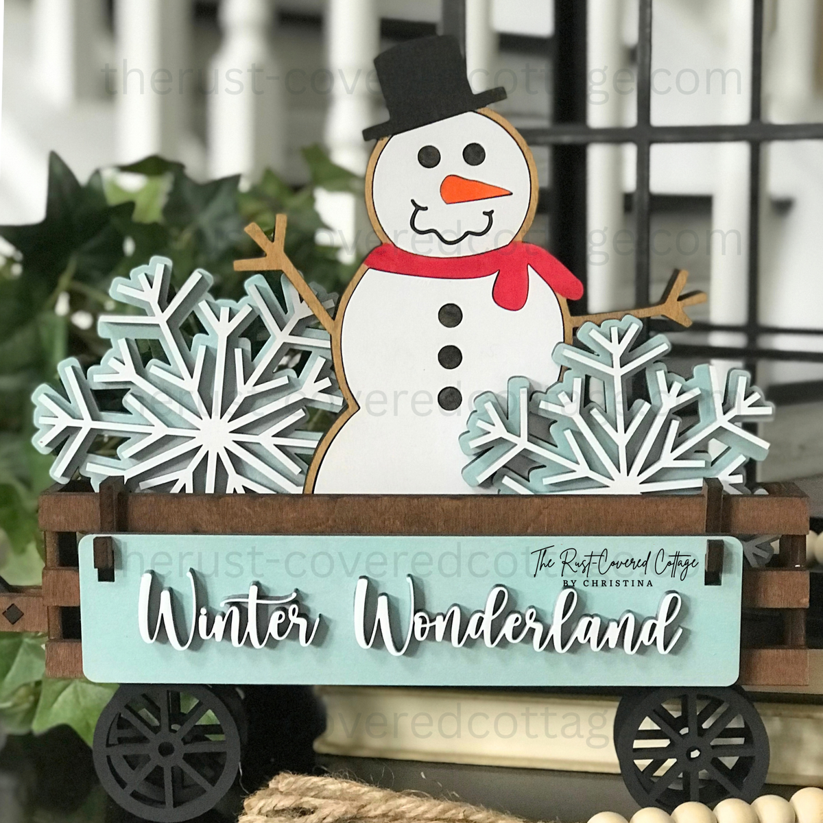 Winter Wonderland Insert with snowman and snowflakes displayed in finished Interchangeable Wagon Base