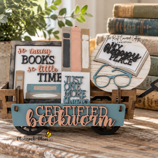 Finished Certified Bookworm wagon insert displayed in a cozy vintage reading nook with stacked books, greenery, and warm natural light.