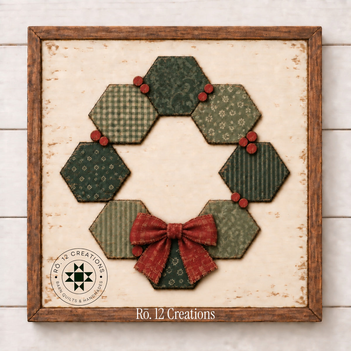 Finished Christmas Hexie Wreath Quilt Block by Rō.12 Creations with green hexagons and red berry accents