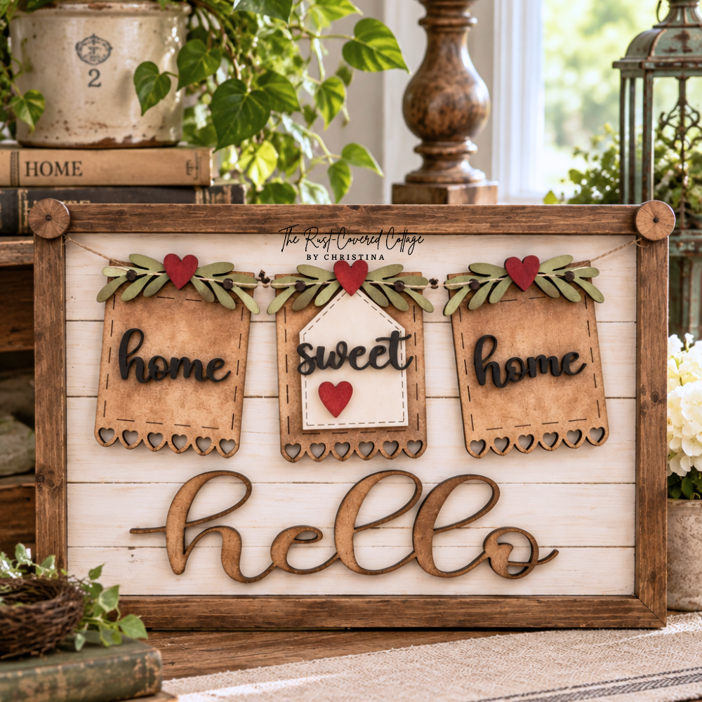 Finished Home Sweet Home interchangeable banner featuring three wood banner pieces with red hearts and greenery on a rustic Hello sign base, styled in a bright vintage cottage setting with books, plants, flowers, and warm wood accents.