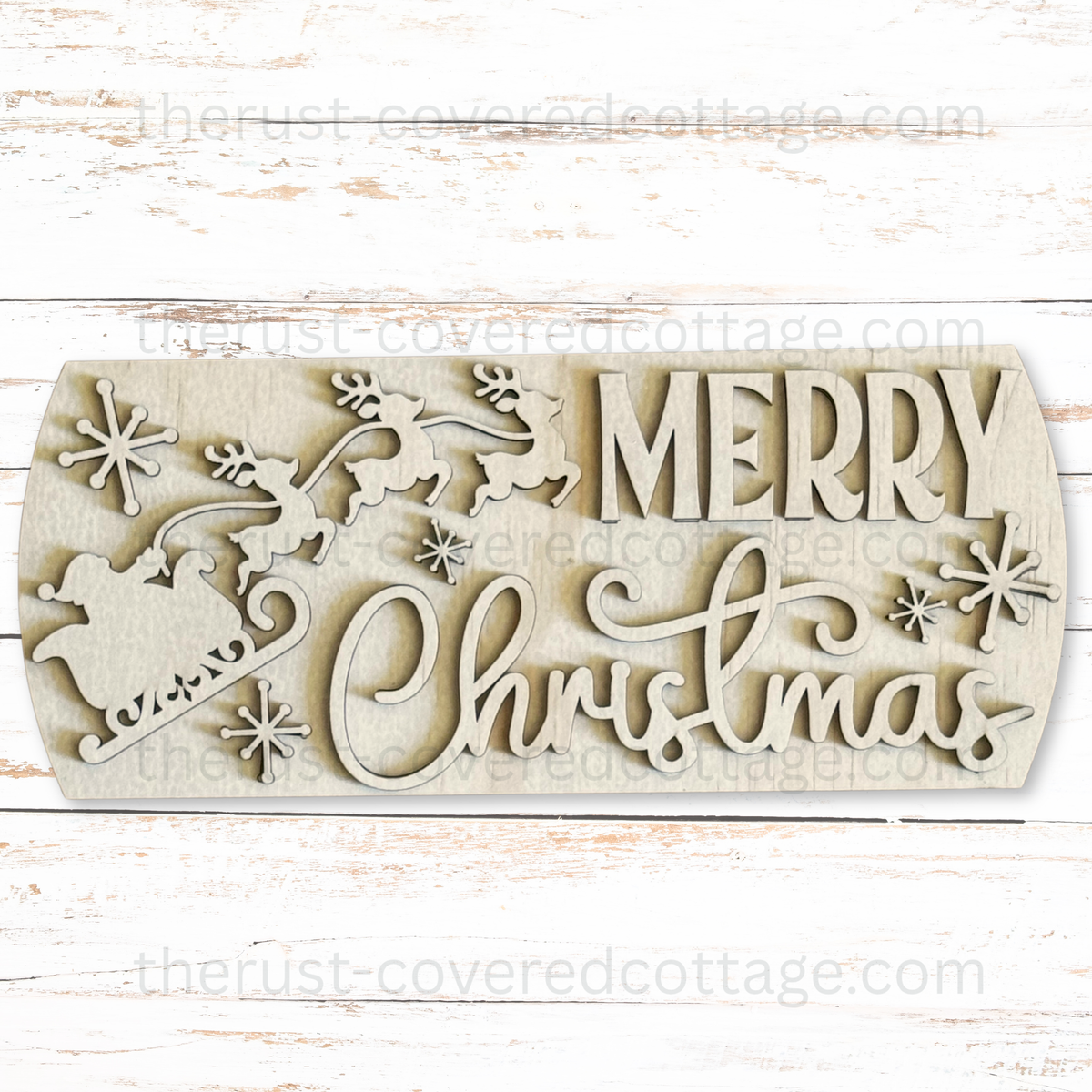 Unfinished Merry Christmas Interchangeable Round Insert with Santa in a sleigh, flying reindeer, snowflakes, and mixed block and script lettering.