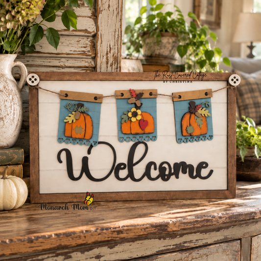Finished Welcome interchangeable sign featuring three fall pumpkin banner inserts, displayed on a distressed vintage cabinet in a bright, collected cottage-style interior.