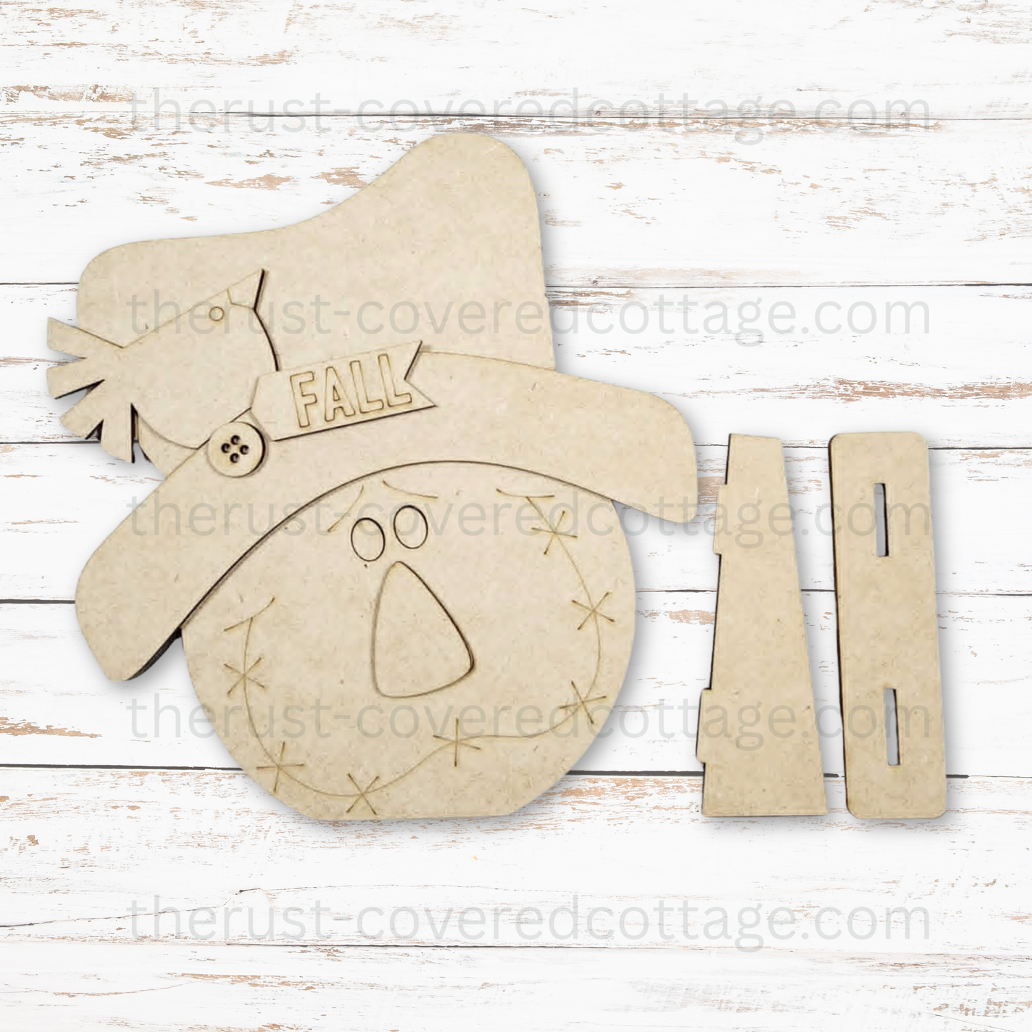 Scarecrow Shelf Sitter unfinished multi-layered DIY wood kit featuring a scarecrow face, oversized hat, crow, fall tag and interlocking base
