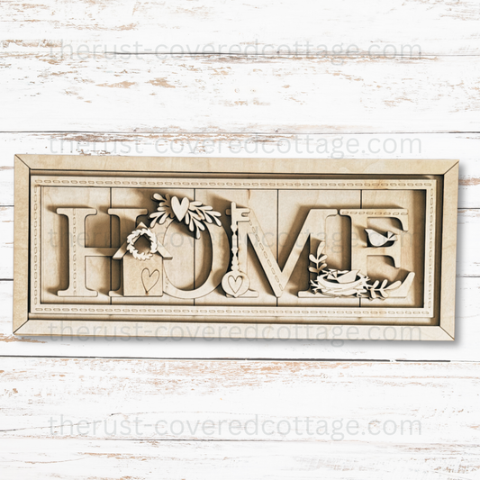 Unfinished Stitched Home Sign multi-layered DIY wood kit featuring HOME lettering, a birdhouse, sewing machine, birds and stitched details