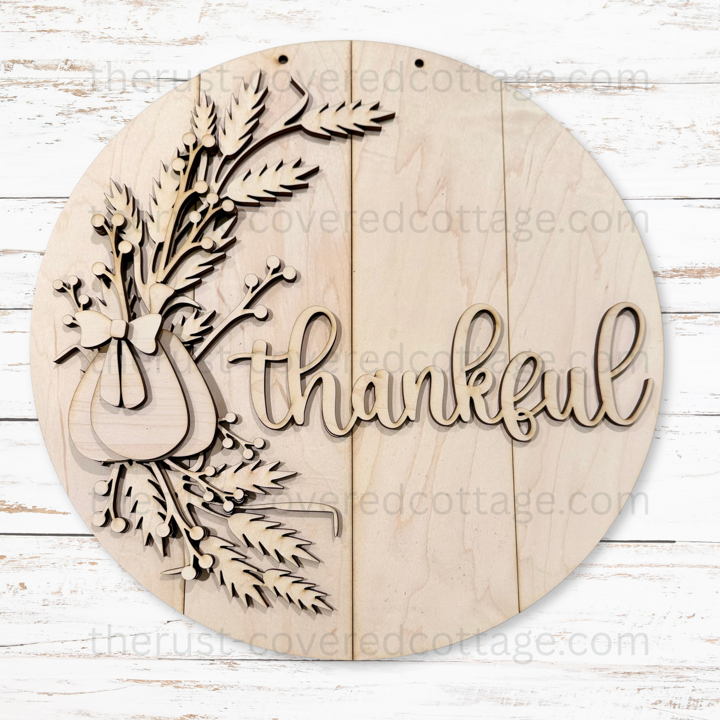 Thankful Harvest Door Hanger multi-layered DIY wood kit featuring a pumpkin, wheat, berry branches and thankful lettering on a 15-inch round