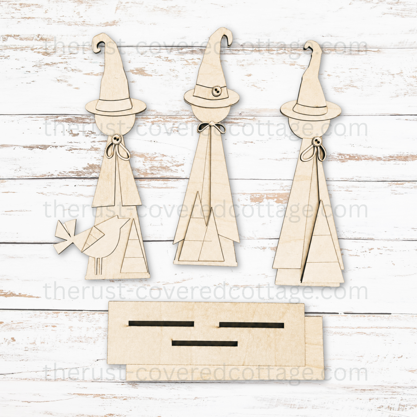 Unfinished Witch Trio multi-layered DIY wood kit featuring three standing witches, a bird accent and slotted display base
