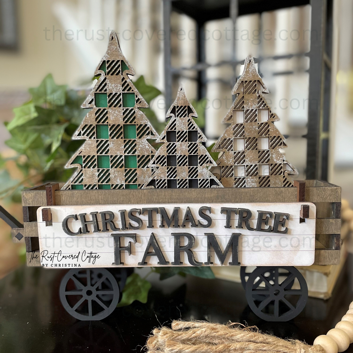 Christmas Tree Farm Insert with three plaid Christmas trees displayed in finished Interchangeable Wagon Base