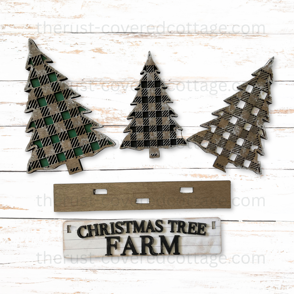 Finished Christmas Tree Farm Insert with three plaid Christmas trees and Christmas Tree Farm sign