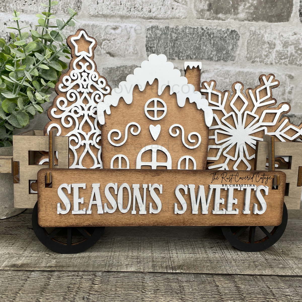 Seasons Sweets Insert with gingerbread house Christmas tree and snowflake displayed in finished Interchangeable Wagon Base